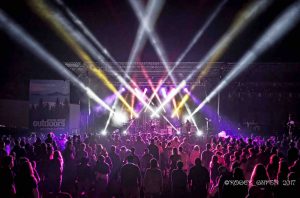 crowd shot at mountain music festival 2017 with Big Something on stage bright lights raging crowd at ACE Adventure Resort