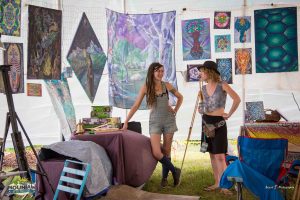 ashton and friend prepping the art tent at mountain music festival on wonderland mountain at ACE Adventure Resort