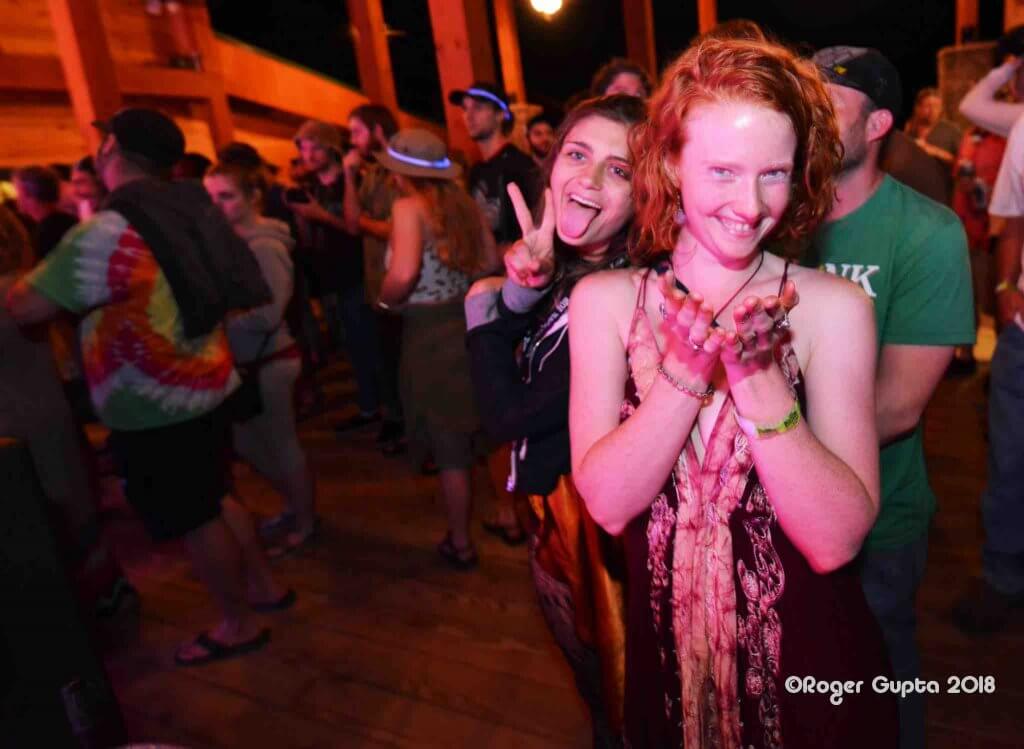 happy guests in the crowd at the mountain music festival thursday night pre party in 2018 at Ace adventure resort on the deck of the lost paddle bar and grill