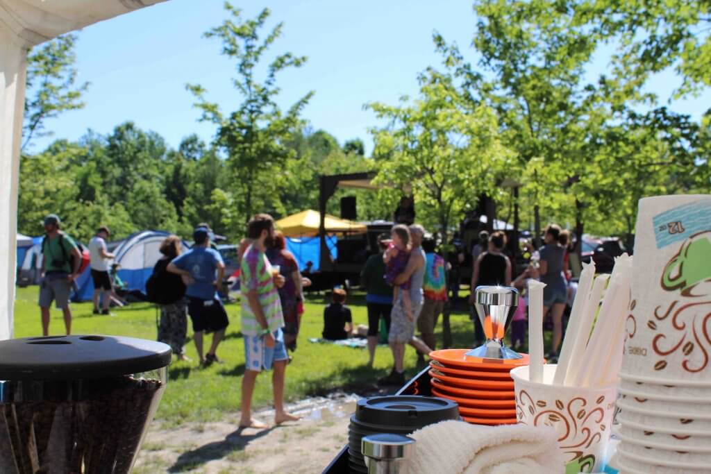 Short & Company performing on the strange stage at mountain music festival 2018 as seen from the strange coffe company booth