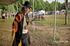 brian zickafoose in pigment santuary at mountain music festival 2018 carrying brushes