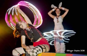 maria and victoria on boxes with light up led hula hoops dancing white rabbit and red queen alice and wonderland theme
