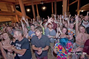 crowd on the deck of the lost paddle at ace adventure resort during mountain music festival 2018 people arms up