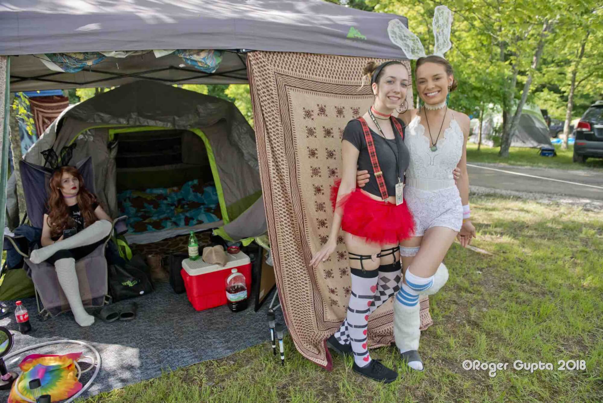 performers at tent in campground at mountain music festival
