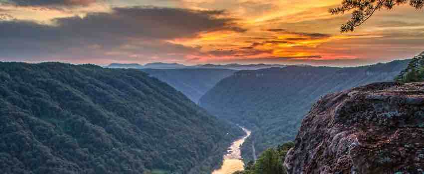 new river gorge west virginia cliffs and river at sunset