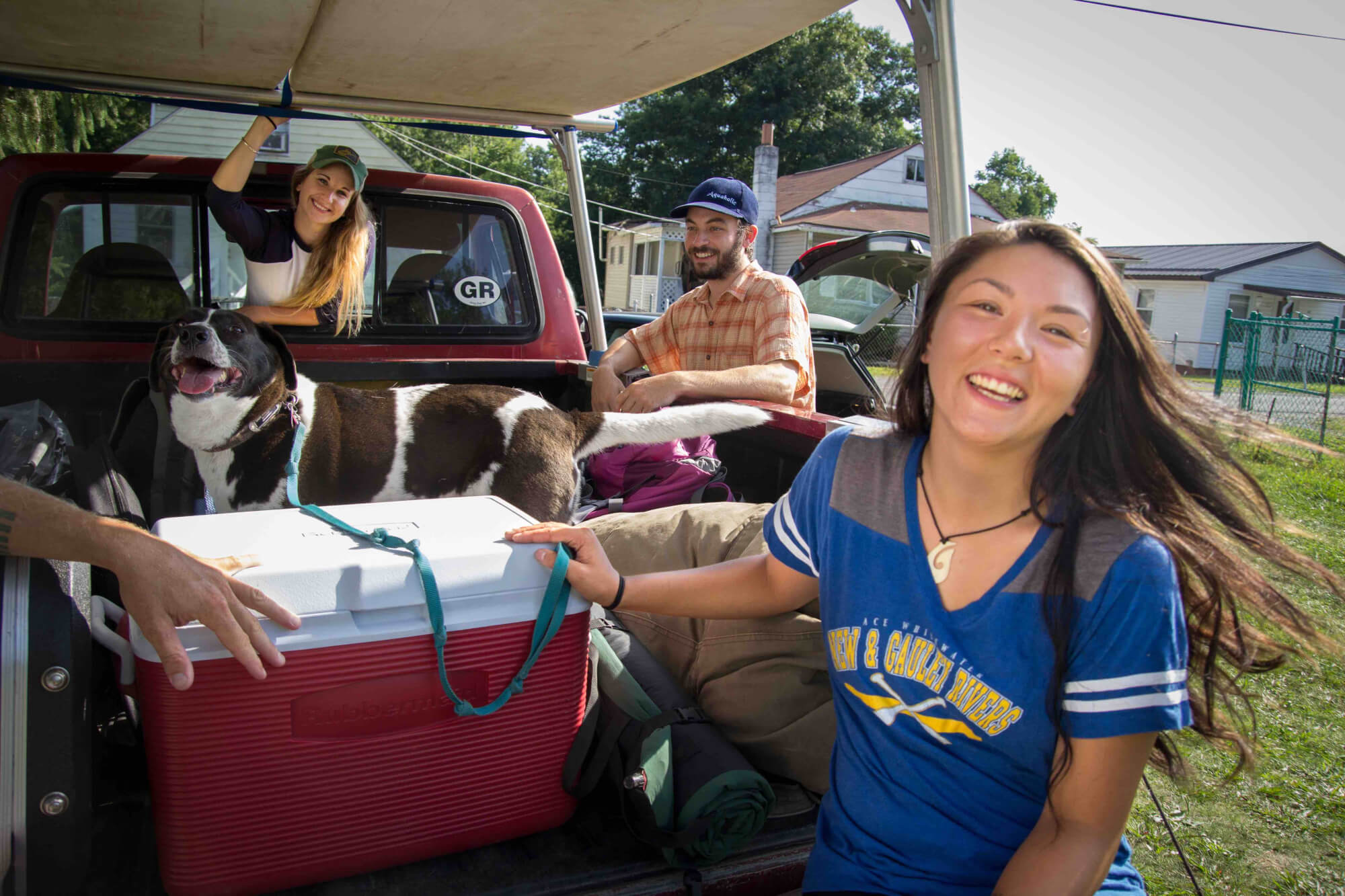 road trip loading the car with sup boards cooolers and dogs