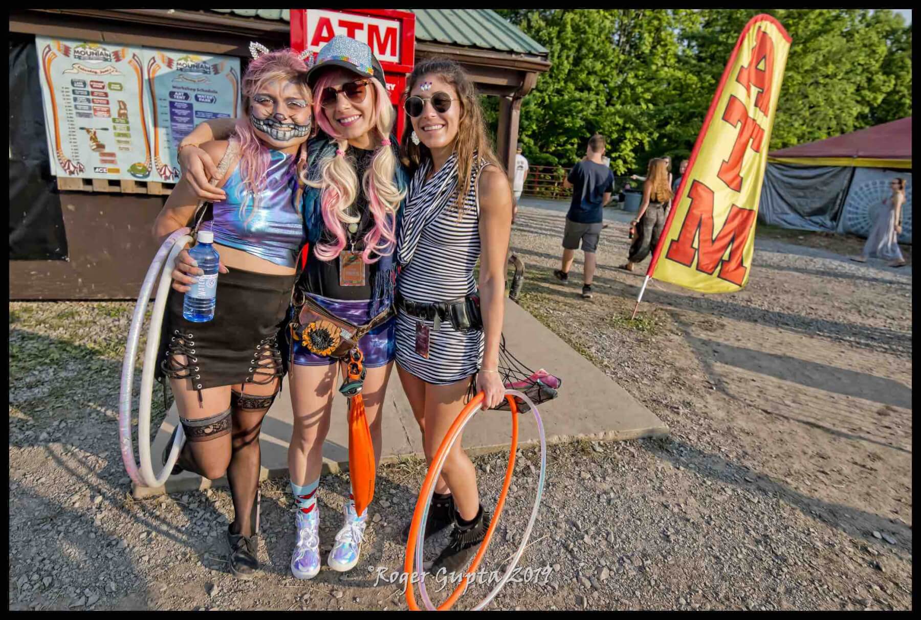 girls hanging out at mountain music festival happy smiles