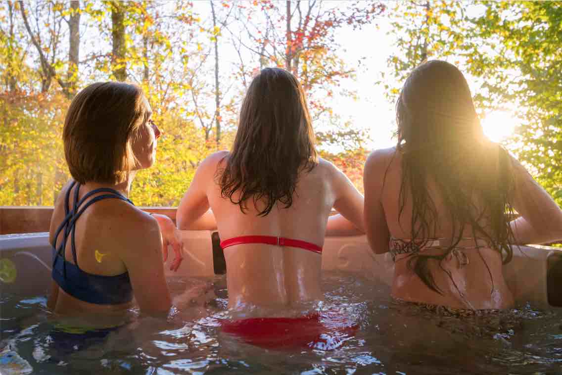 girls in cabin hot tub at ace adventure resort new river gorge west virginia