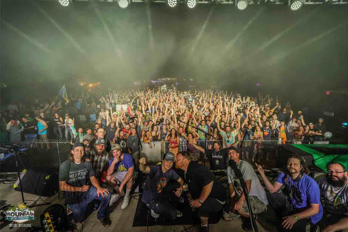 big something closing out show with stage photo of crowd fans and band