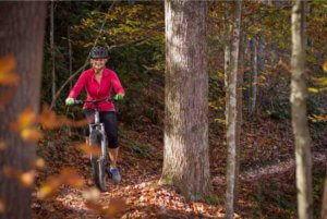 girl mountain biking in the new river gorge at ace adventure resort