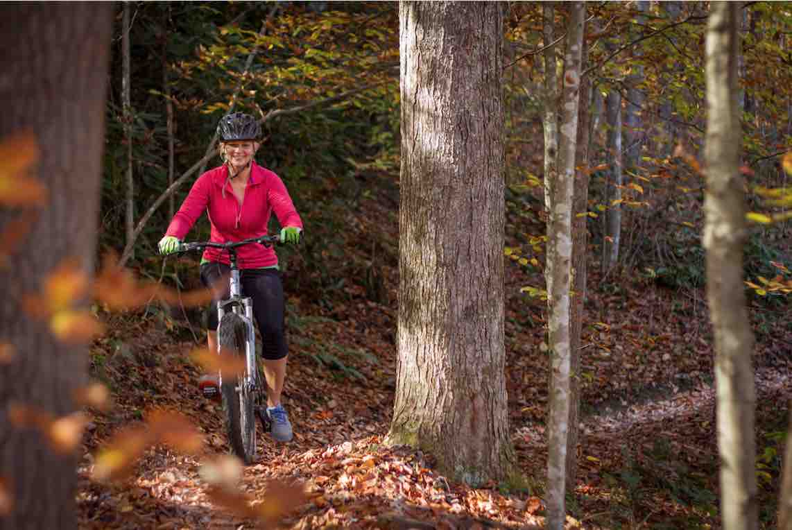 girl mountain biking in the new river gorge at ace adventure resort