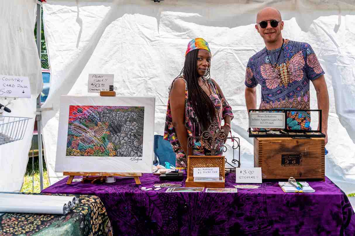 brian zickafoose in his art tent at mountain music festival 2021