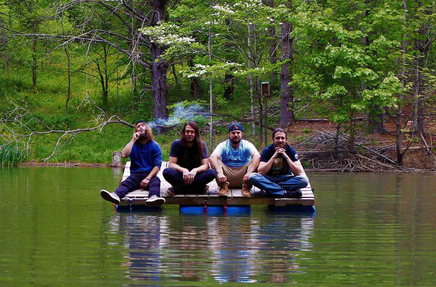 buddhagraph spaceship band press photo on raft in water