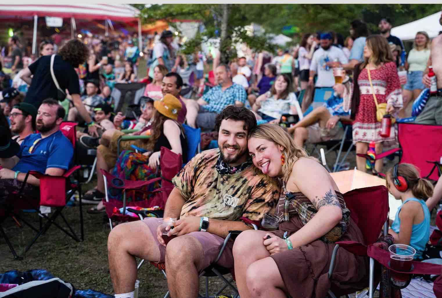 happy people hanging out in camp chairs at main stage mountain music festival