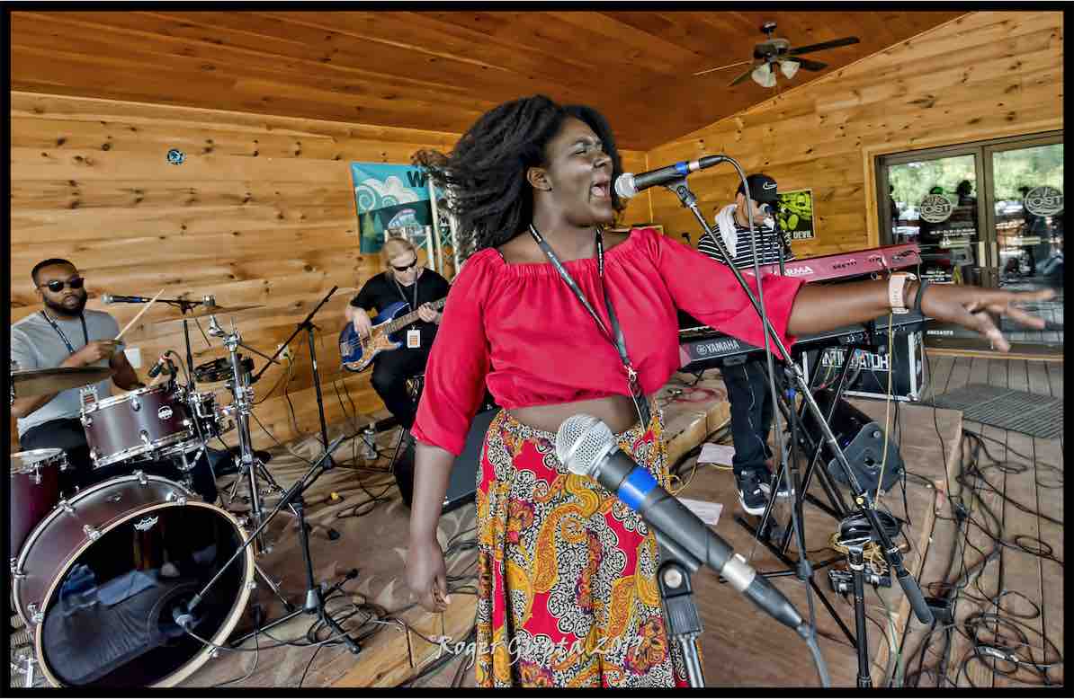 joslyn and the sweet compression perfoming on the lake stage at mountain music festival 