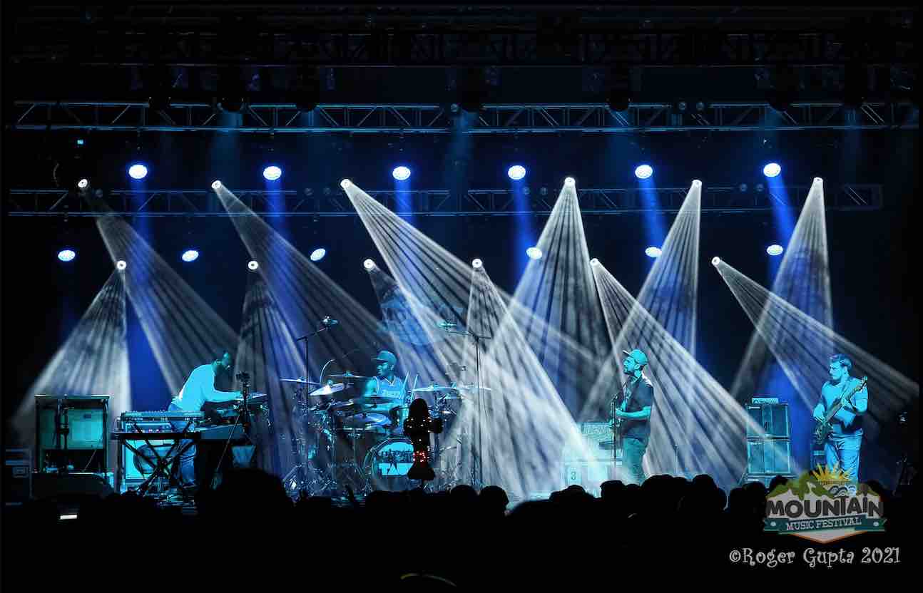 tauk performing under the lights on the main stage at mountain music festival 2021