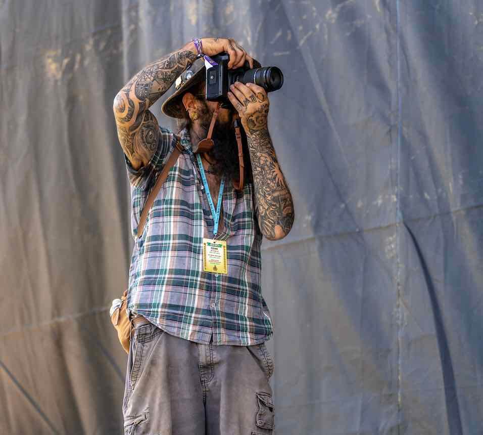 photographer getting the shot at mountain music festival