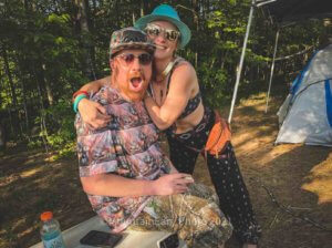 happy couple of campers at mountain music festival