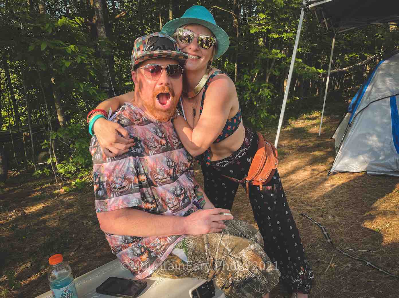happy couple of campers at mountain music festival