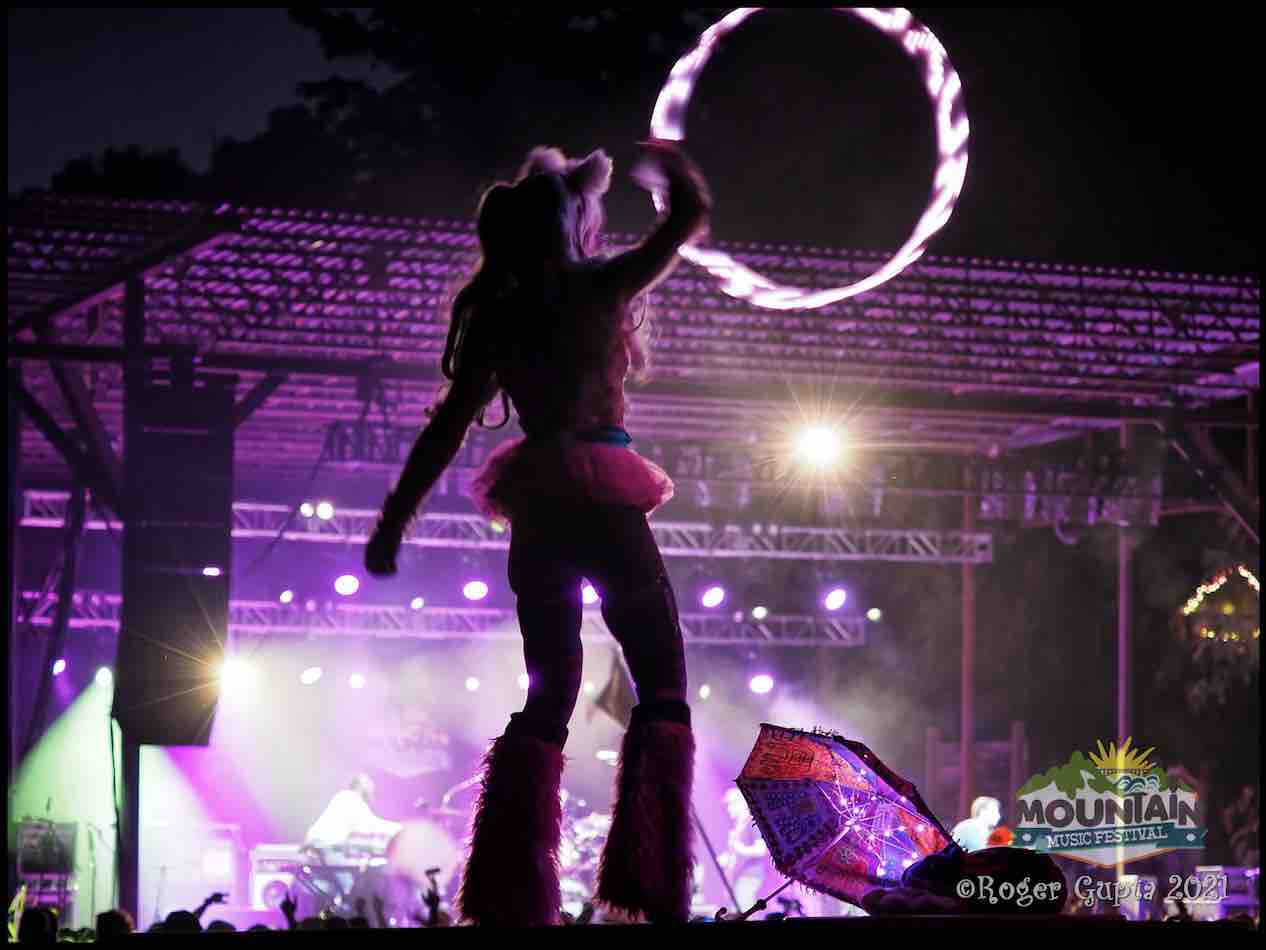 performer hooping in front of stage during TAUK at mountain music festival 2021