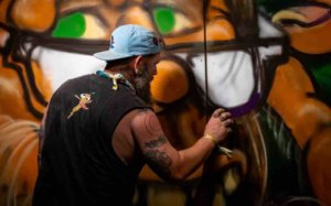rob fogle painting sasquatch at mountain music festival