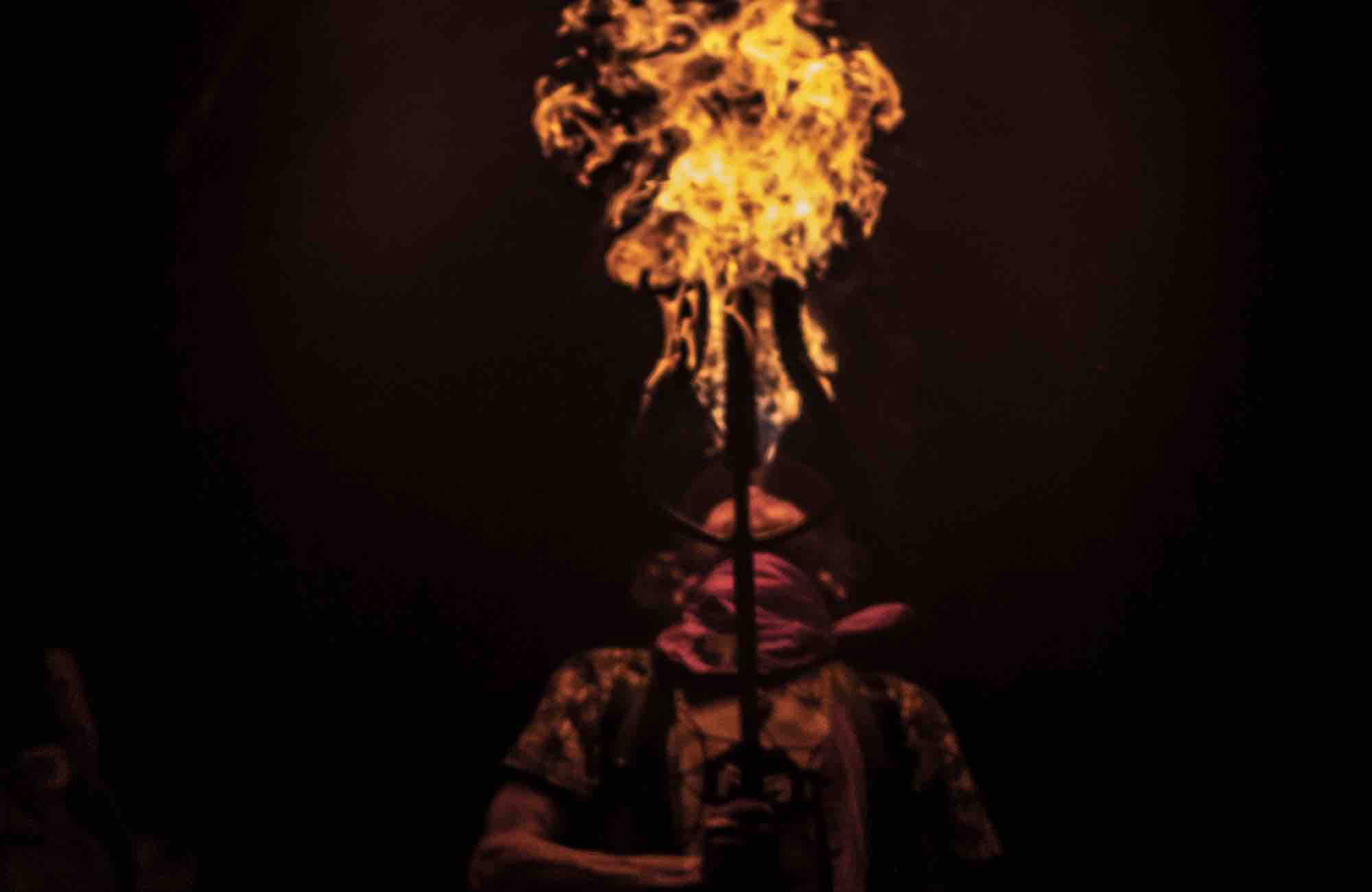Fire performer at mountain music festival