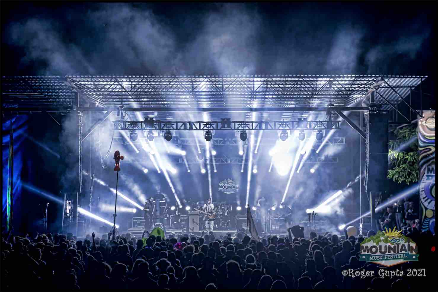 big something performing under the lights at mountain music festival 2022 stage photo