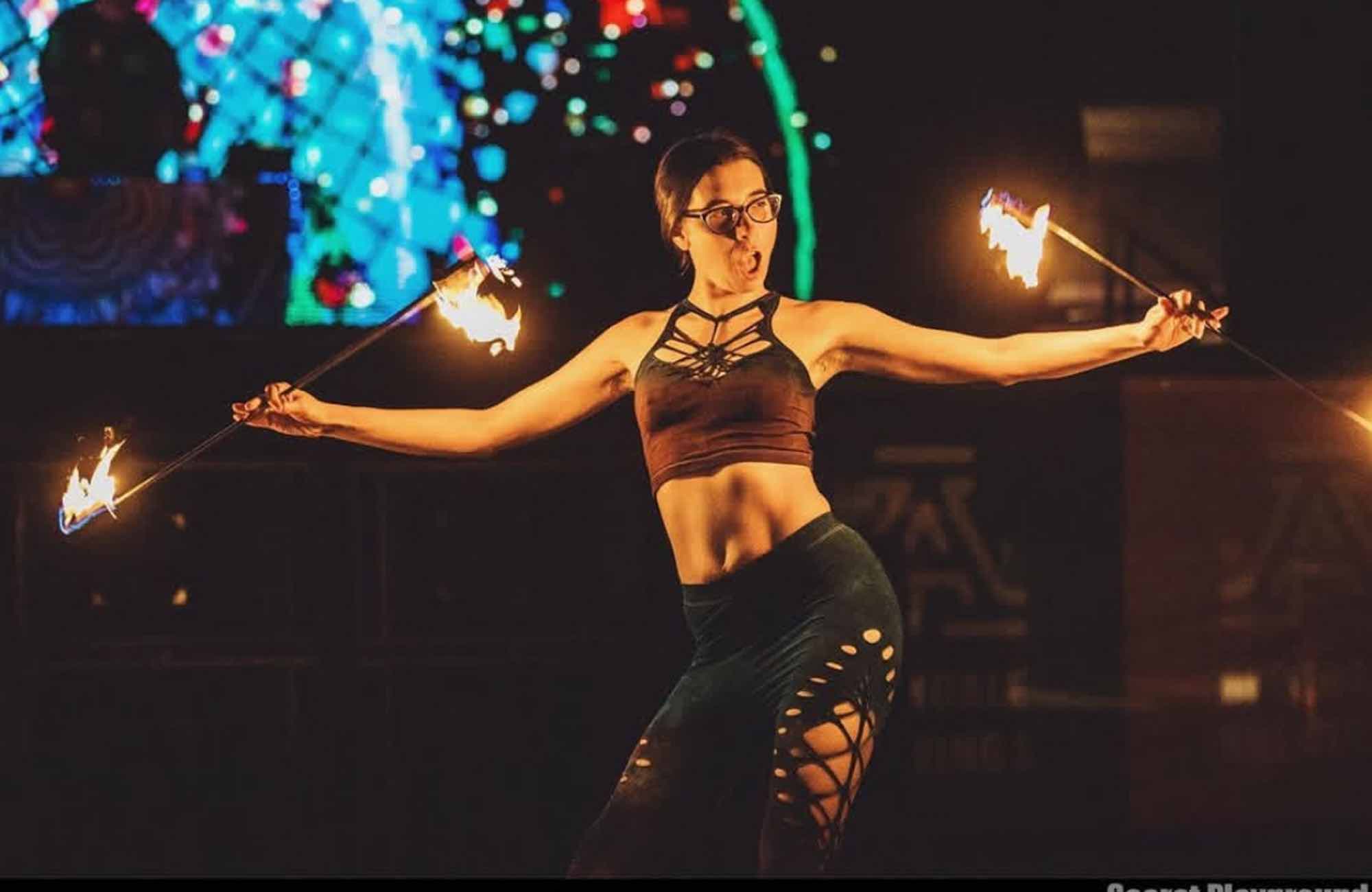 Fire performer at mountain music festival