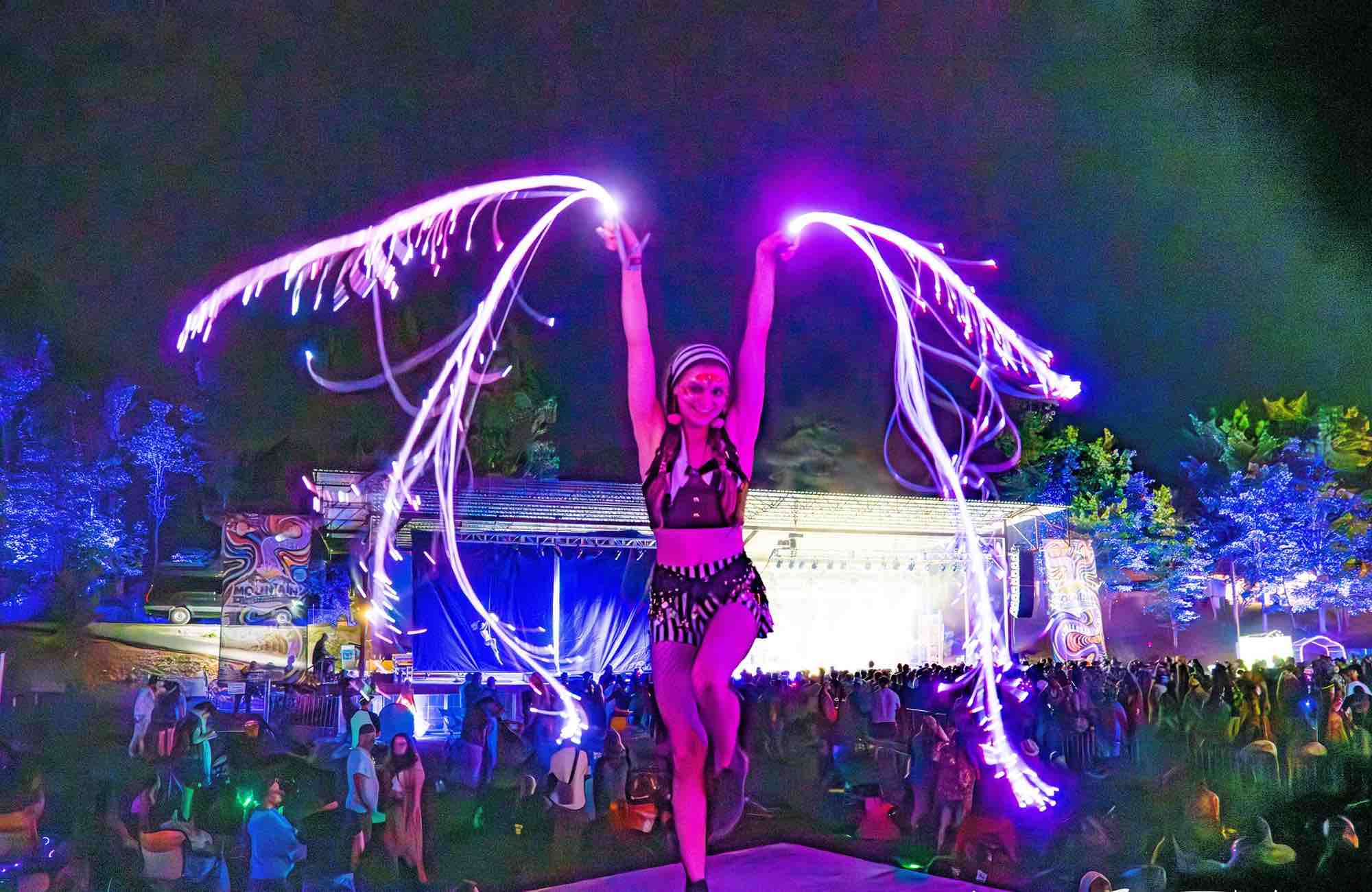 Fire performer at mountain music festival