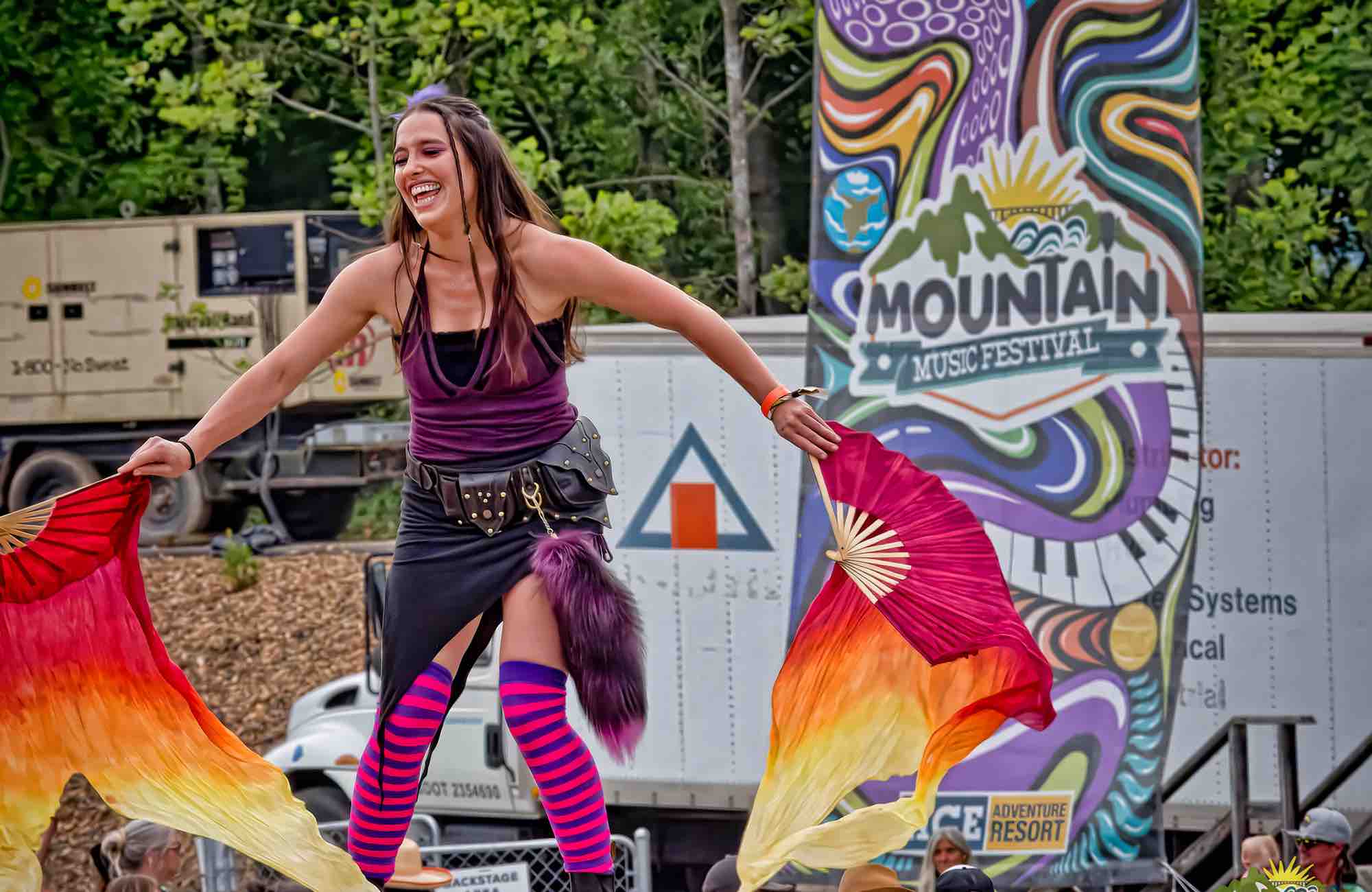 Fire performer at mountain music festival